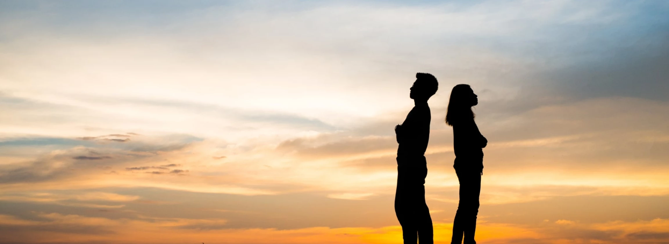 silhouette of couple upset man and women are quarrel in sunset time