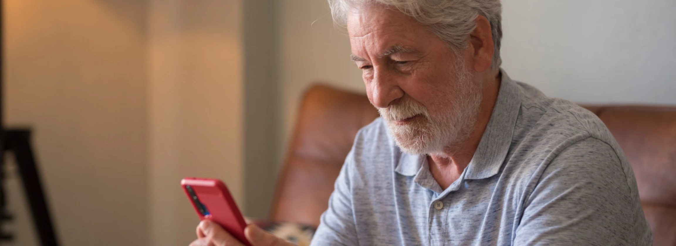 Mature handsome man text and write message on the smartphone