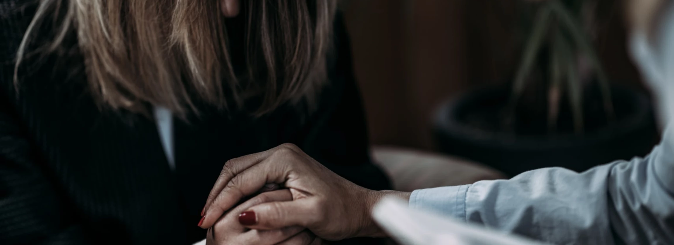 psychotherapist talking with woman suffering from PTSD