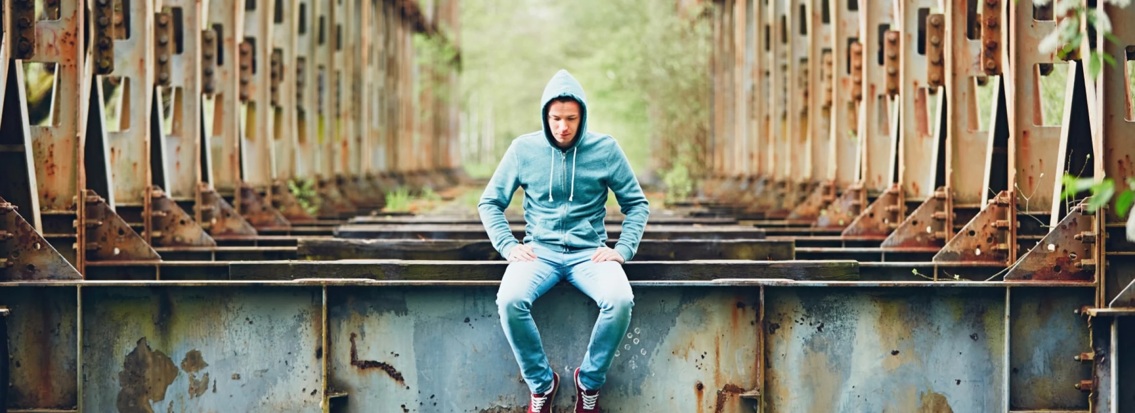sad man on the abandoned bridge