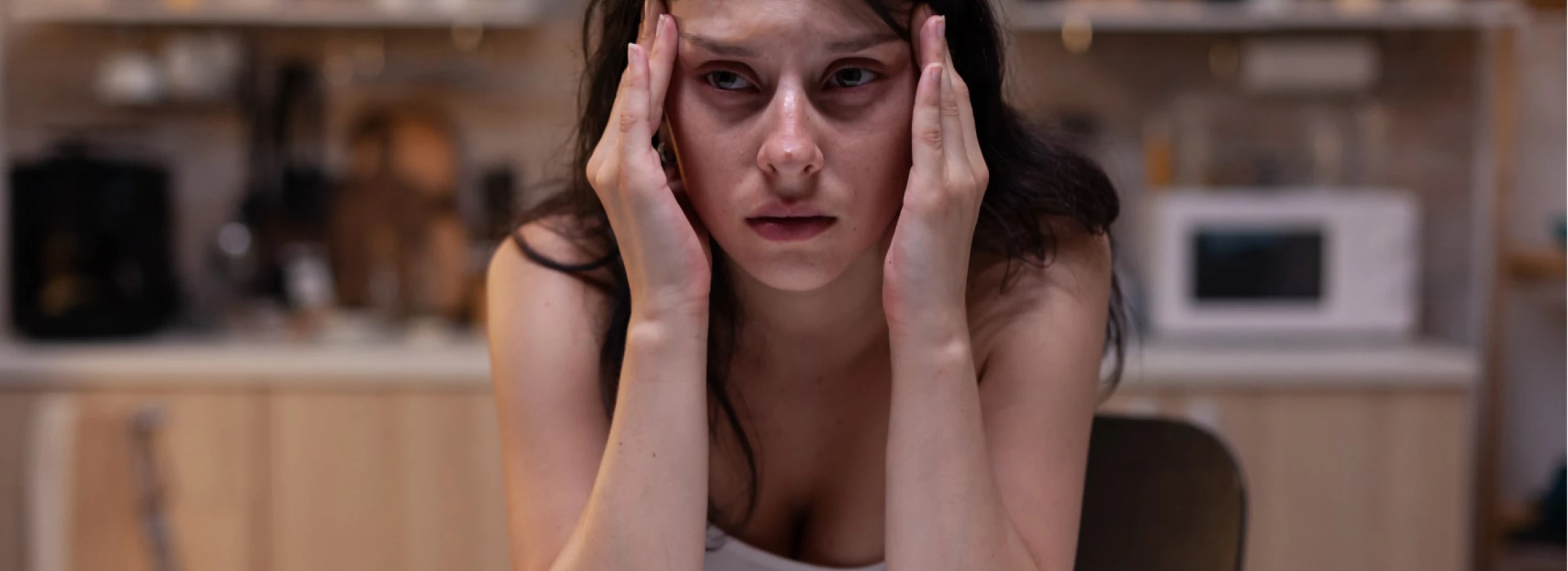 portrait of upset woman with serious headache pain