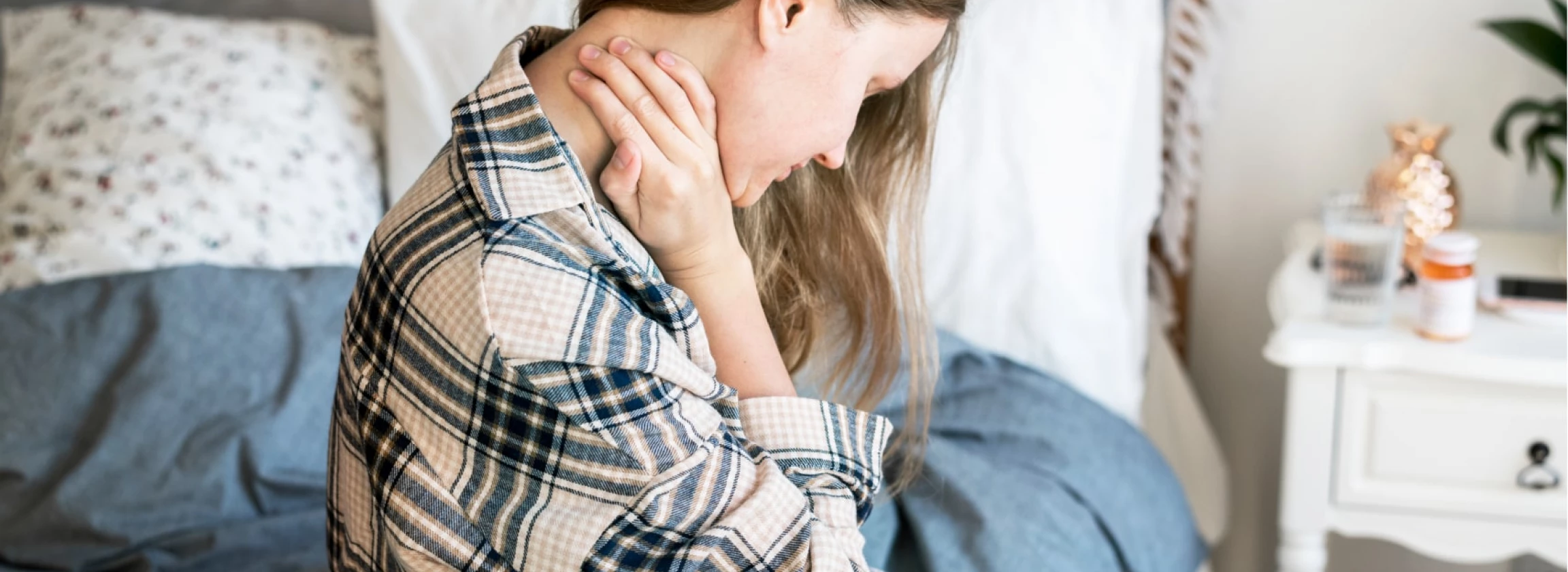 caucasian girl wake up with neck pain