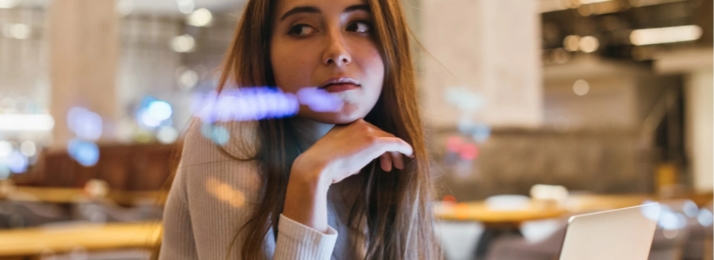sad and lonely young woman waits at cafe or office