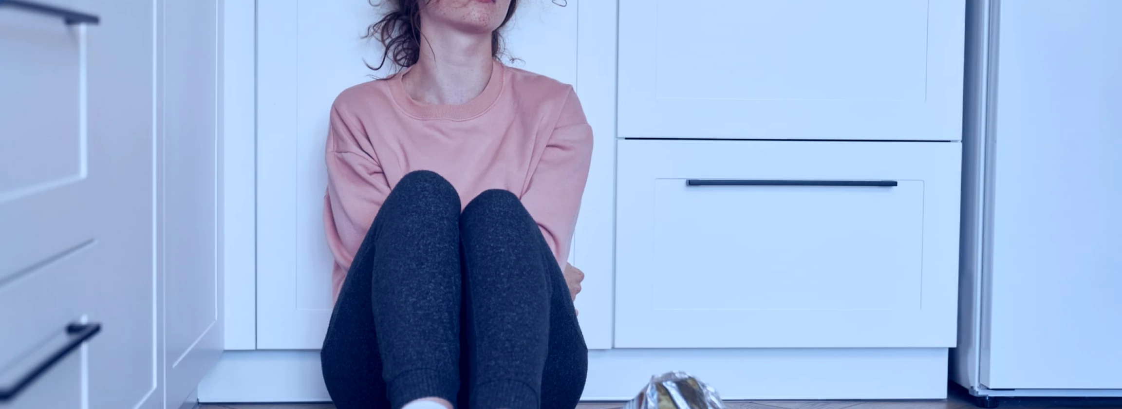 a young Caucasian woman devouring some food