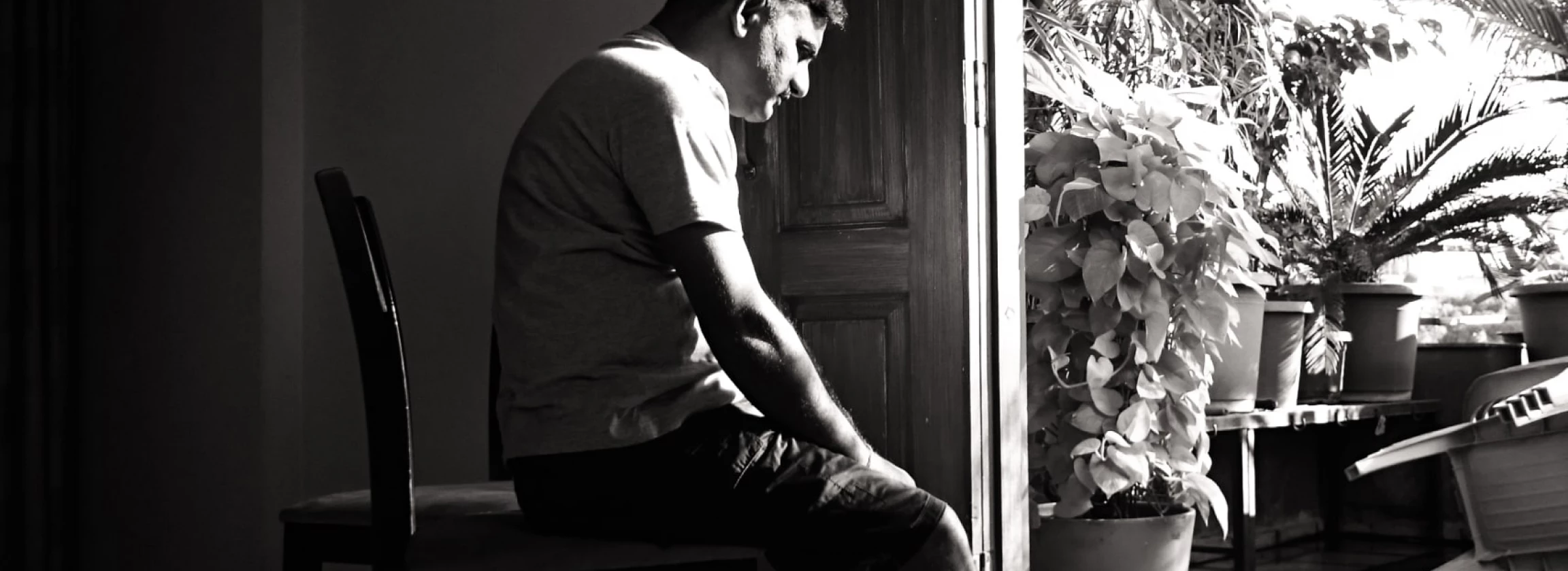 man sitting alone having intrusive thoughts