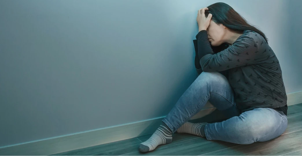 unrecognizable woman with anxiety disorder with hands in head
