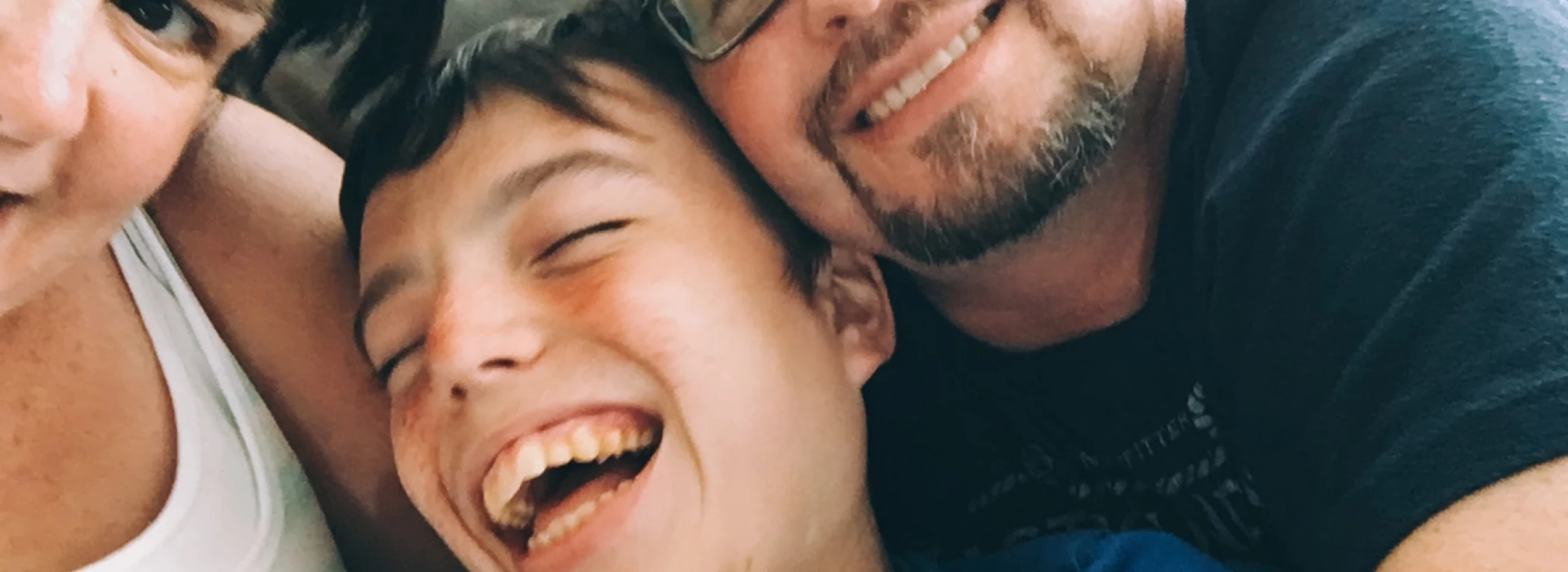 happy parents with their autistic child
