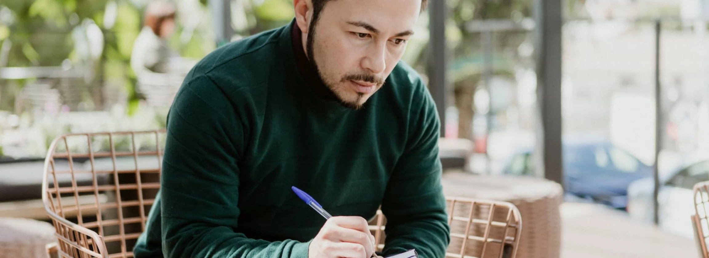 A guy with computer or a phone writing