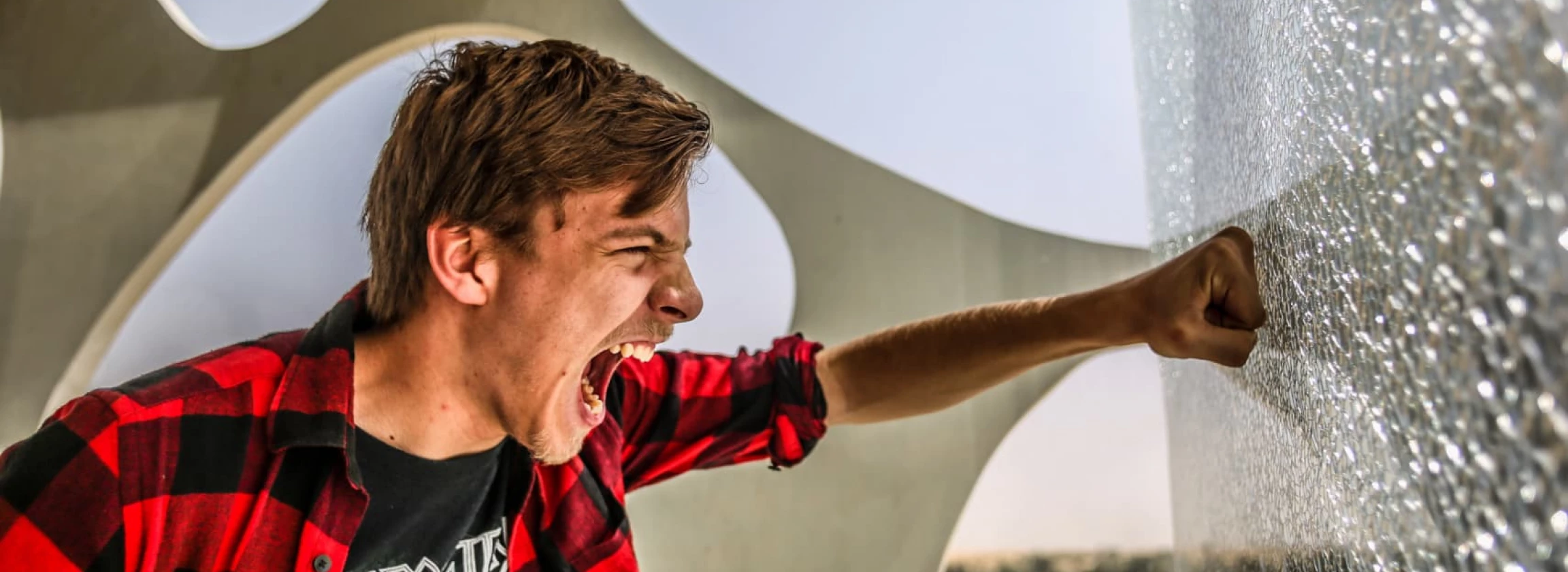 young man is extremely angry