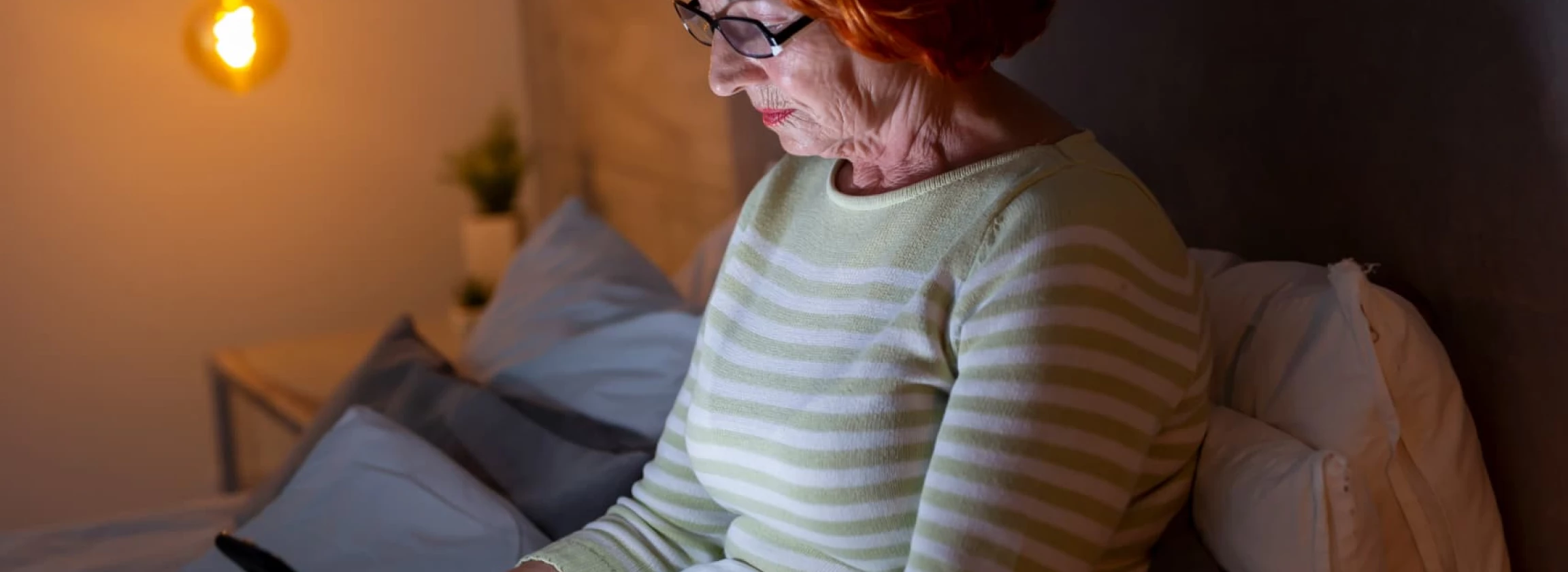 senior woman typing a text message on smart phone