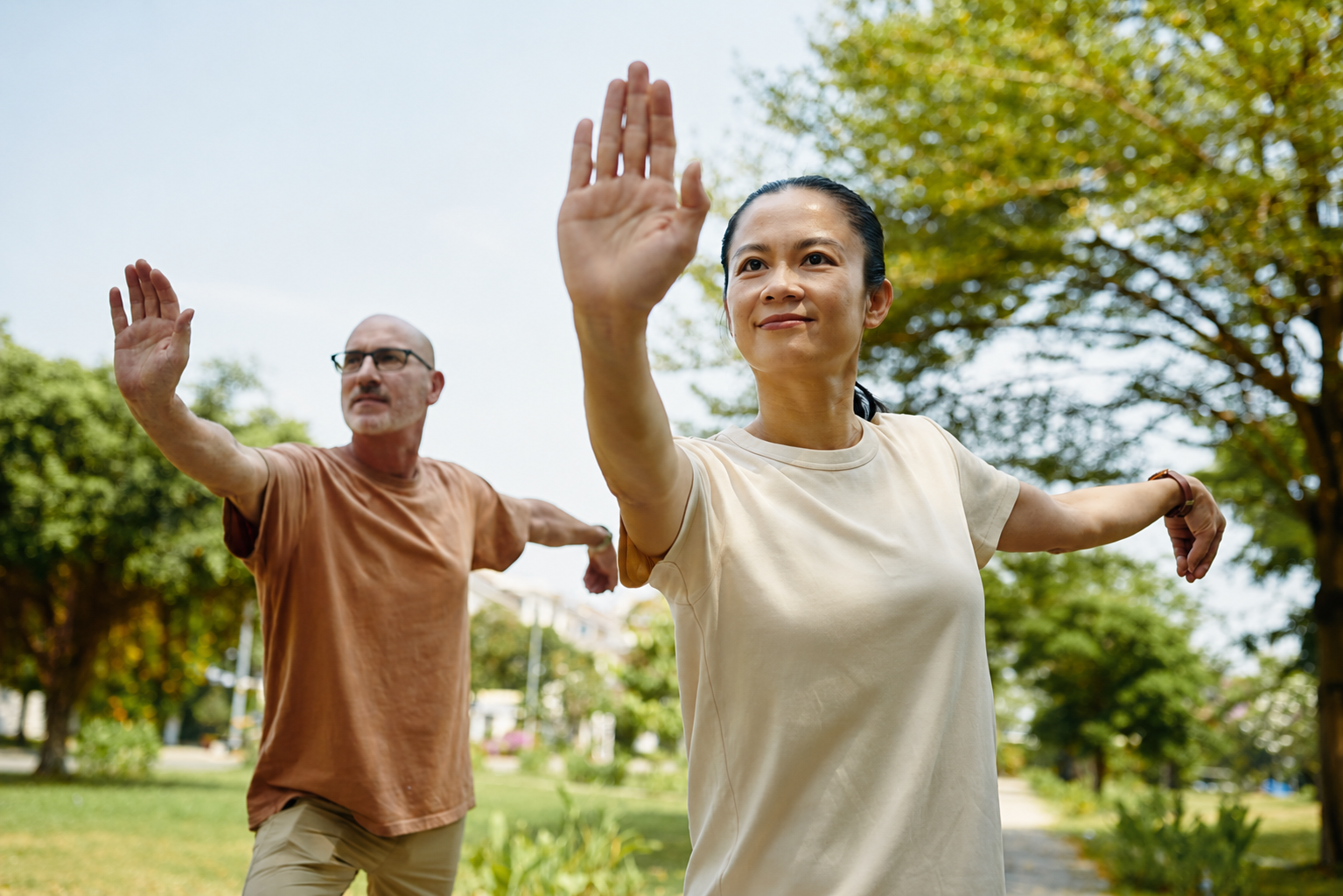 woman and man doing tai chi